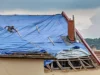 The Work That Happens Between Tarp and New Roof