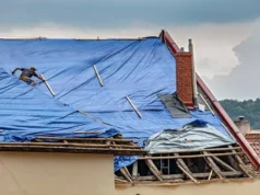 The Work That Happens Between Tarp and New Roof