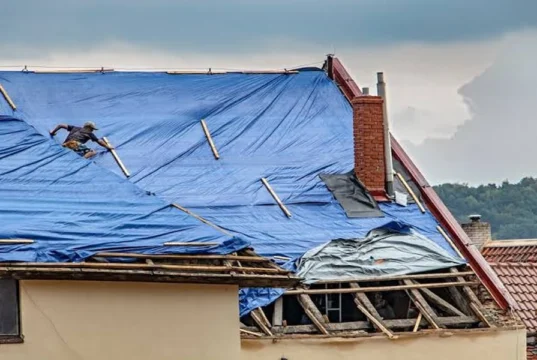 The Work That Happens Between Tarp and New Roof